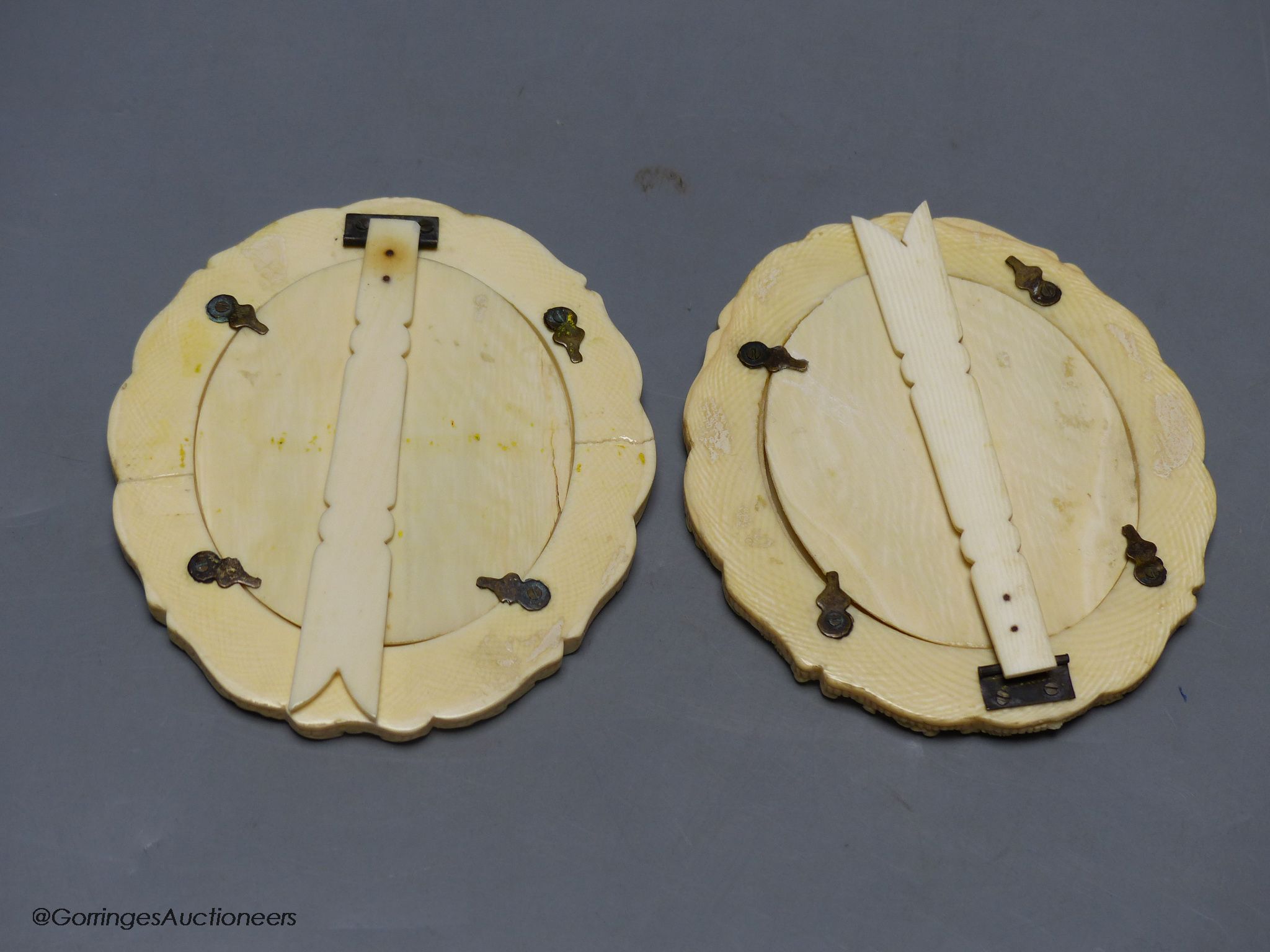 An associated pair of late 19th / early 20th century Canton carved ivory photo frames, 10cm high.